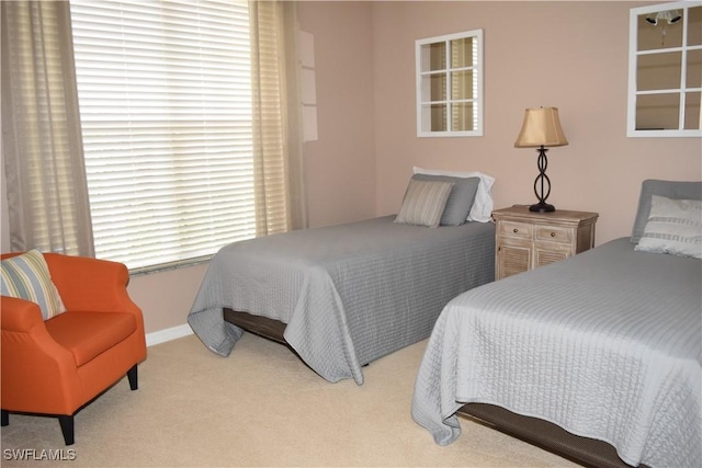 bedroom with light colored carpet