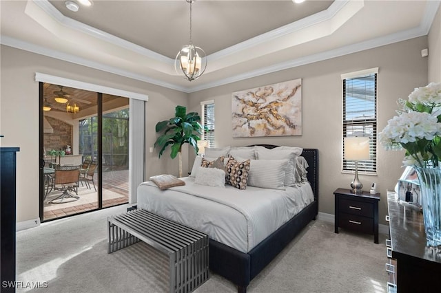 bedroom with access to outside, a raised ceiling, and light carpet