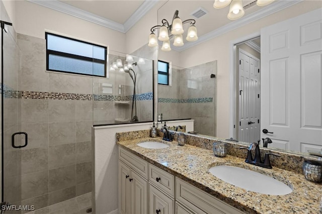 full bathroom featuring crown molding, visible vents, a walk in shower, and a sink