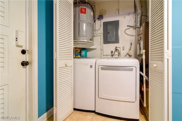 laundry area with electric panel, washing machine and clothes dryer, and light tile patterned flooring