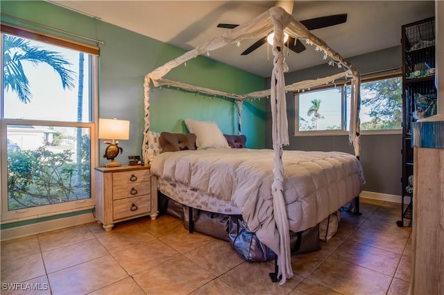 bedroom with tile patterned floors and ceiling fan