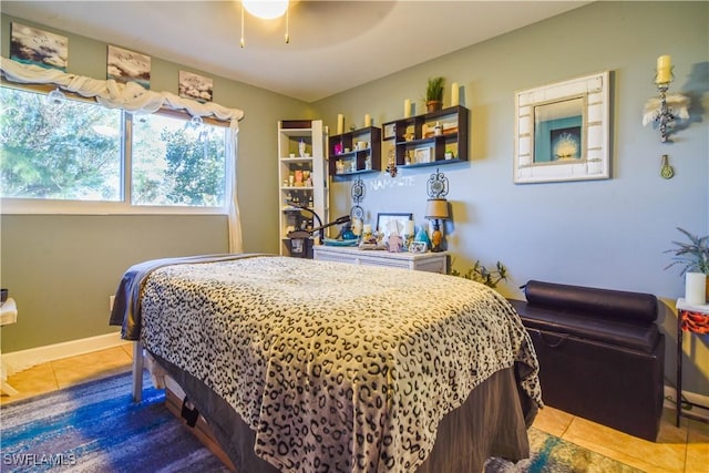 bedroom featuring ceiling fan and tile patterned floors