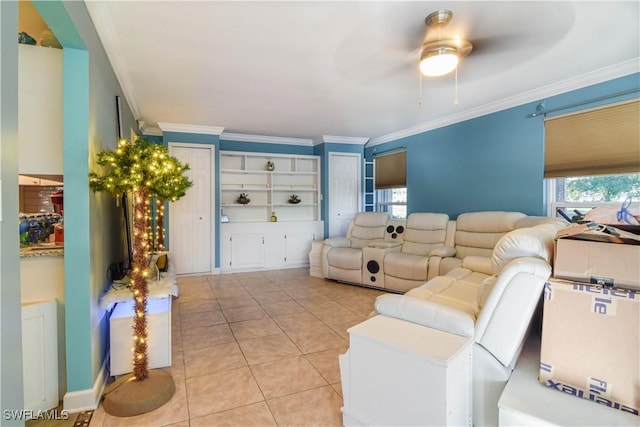 tiled living room with crown molding and ceiling fan