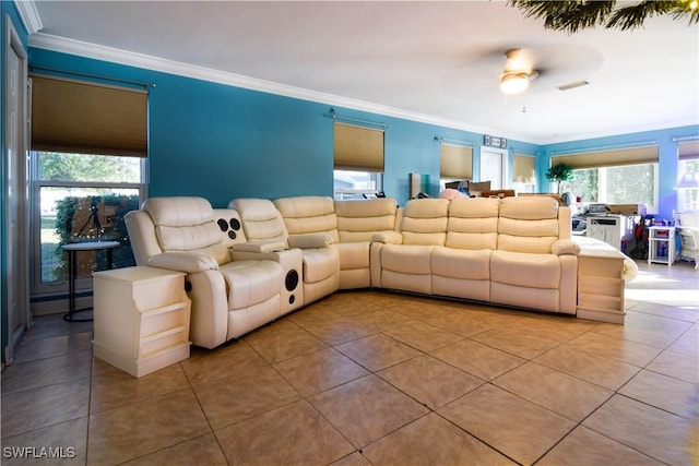 living room with crown molding, light tile patterned flooring, ceiling fan, and a baseboard radiator