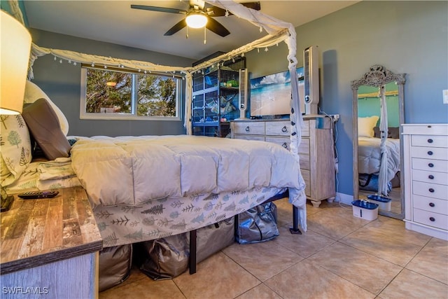 bedroom featuring ceiling fan and tile patterned flooring