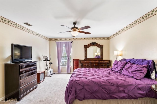 bedroom featuring ceiling fan and light colored carpet