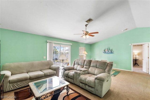 carpeted living room featuring vaulted ceiling and ceiling fan