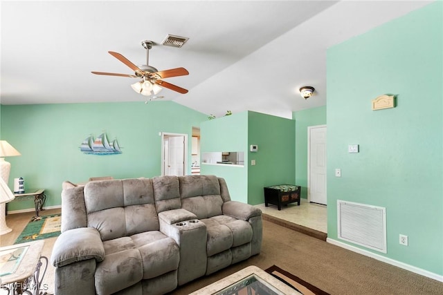 living room featuring vaulted ceiling, carpet flooring, and ceiling fan