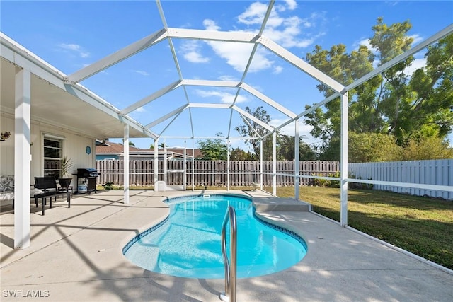 view of pool featuring area for grilling, a yard, a lanai, and a patio