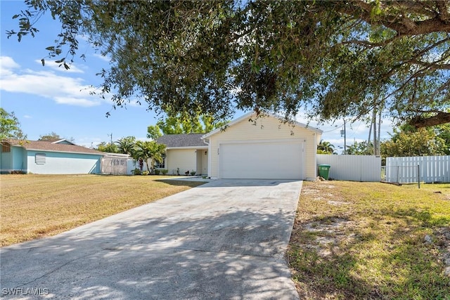 ranch-style house with a garage and a front lawn