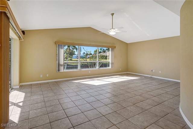 interior space with vaulted ceiling, light tile patterned flooring, and ceiling fan