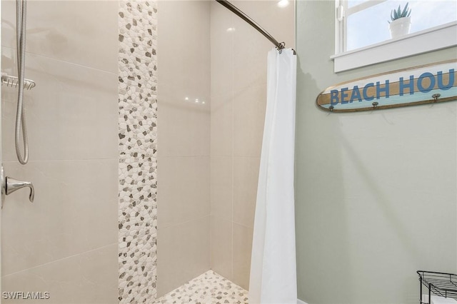 bathroom with a shower with shower curtain