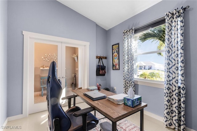 office area with light tile patterned floors and french doors