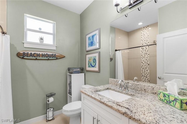 bathroom featuring a shower with curtain, vanity, and toilet