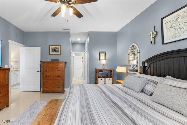 bedroom with ceiling fan, connected bathroom, and light tile patterned floors