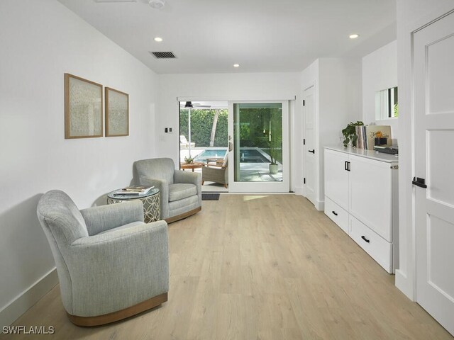 sitting room featuring light hardwood / wood-style flooring