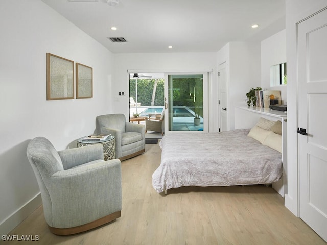 bedroom with access to outside, visible vents, light wood-style flooring, and recessed lighting