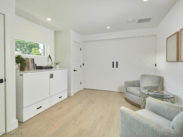 sitting room featuring light wood-type flooring