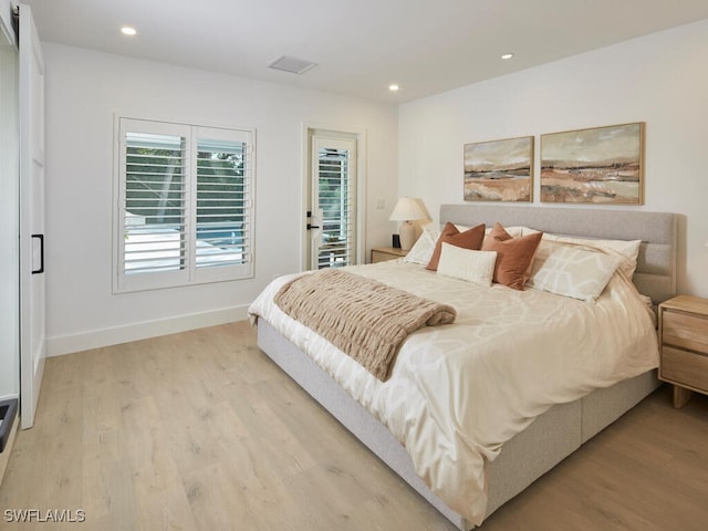 bedroom featuring baseboards, recessed lighting, visible vents, and light wood-style floors