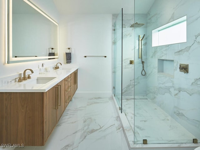 full bath featuring marble finish floor, a sink, a marble finish shower, and double vanity