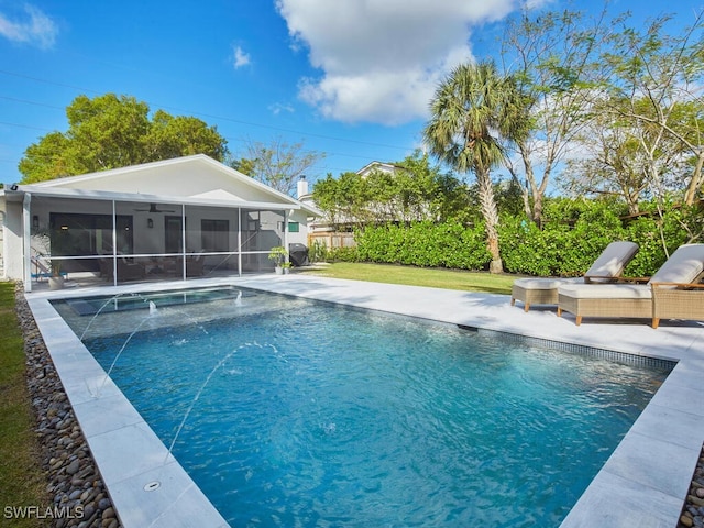 view of pool with a fenced in pool, a yard, a sunroom, a patio area, and fence private yard