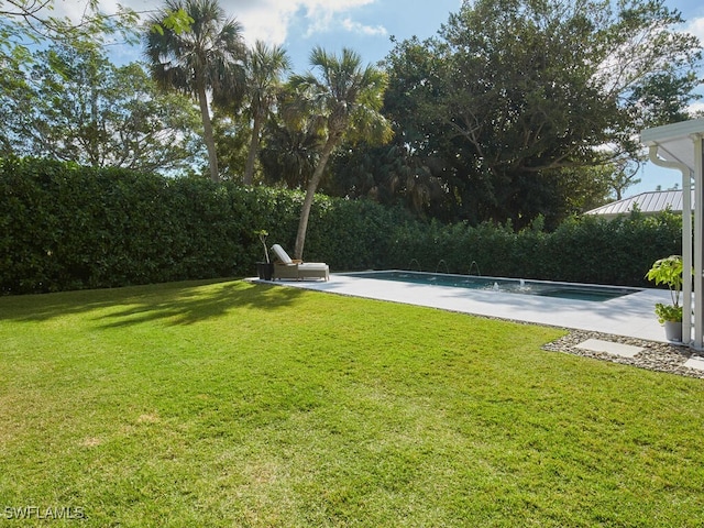 view of yard featuring an outdoor pool