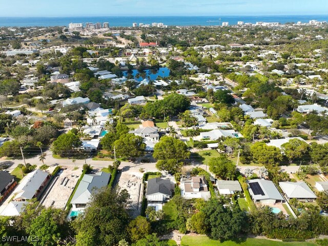 bird's eye view featuring a water view and a residential view