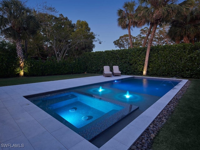 view of swimming pool featuring an in ground hot tub, a patio, and a fenced backyard