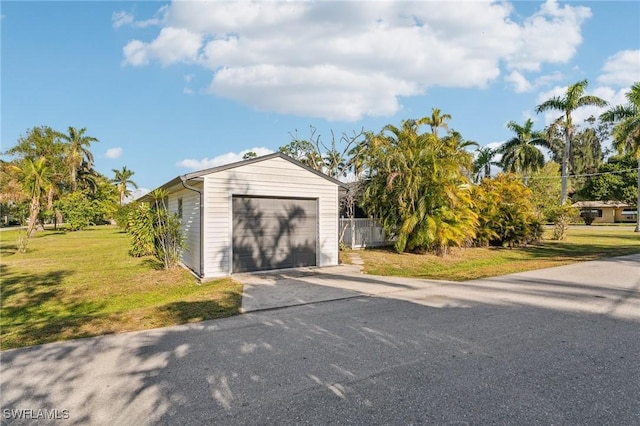 garage featuring a yard