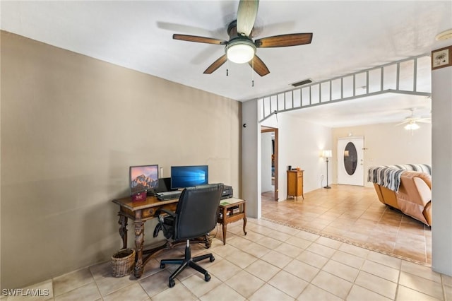 office space featuring light tile patterned flooring and ceiling fan