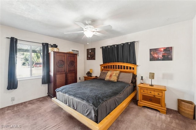 bedroom featuring ceiling fan and carpet