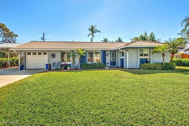 ranch-style home featuring a garage and a front yard