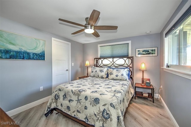 bedroom with ceiling fan and light hardwood / wood-style flooring