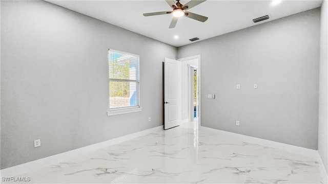 unfurnished room with ceiling fan