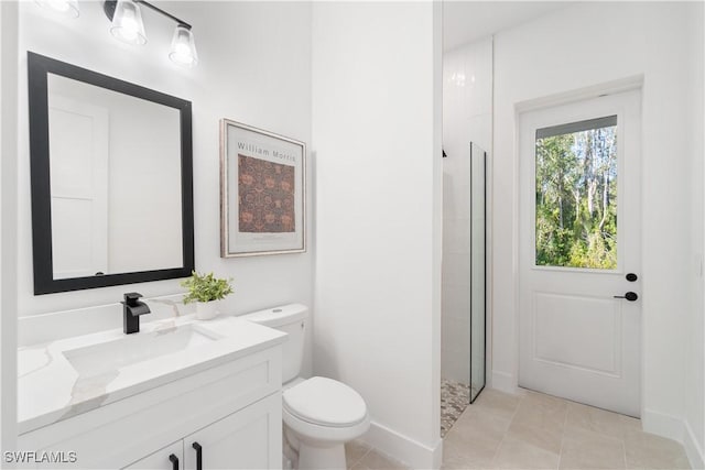 bathroom with baseboards, a walk in shower, toilet, and vanity