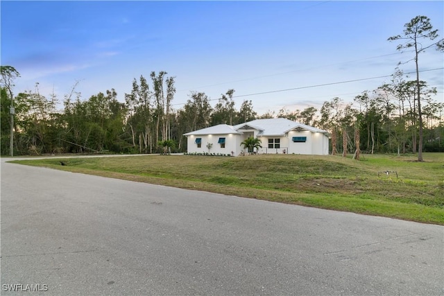 view of front of home with a front lawn