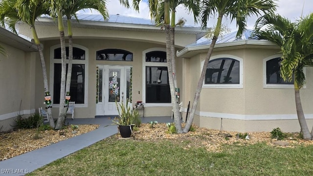 doorway to property with a yard