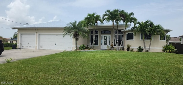 ranch-style home with a garage and a front lawn