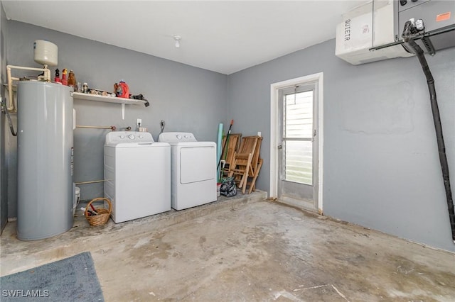 washroom with water heater, an AC wall unit, and washer and clothes dryer