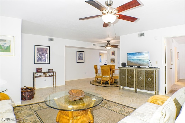 living room with visible vents and baseboards