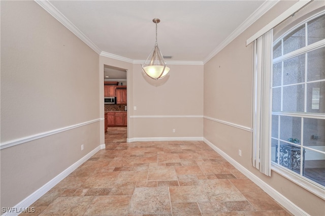 unfurnished dining area with crown molding