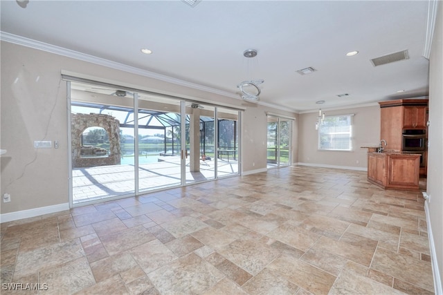 unfurnished living room featuring ornamental molding