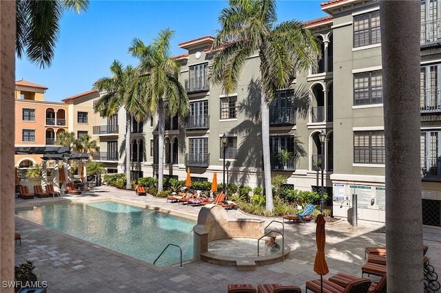 view of swimming pool with a patio