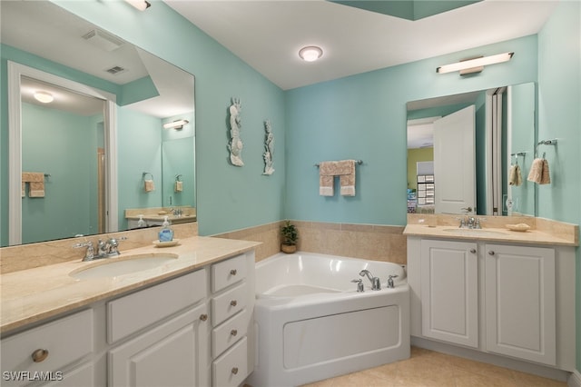 full bath with two vanities, visible vents, a sink, tile patterned flooring, and a bath