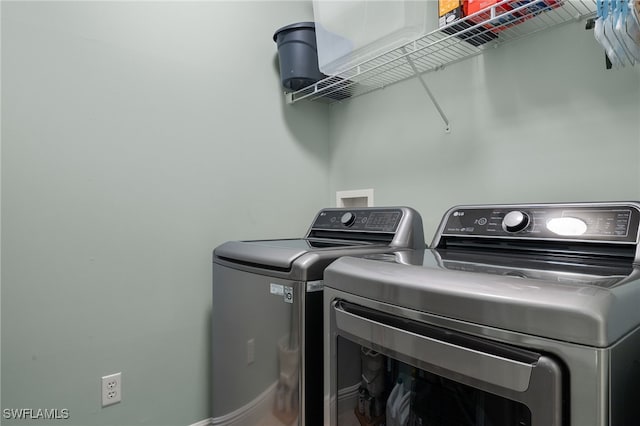 laundry room featuring separate washer and dryer