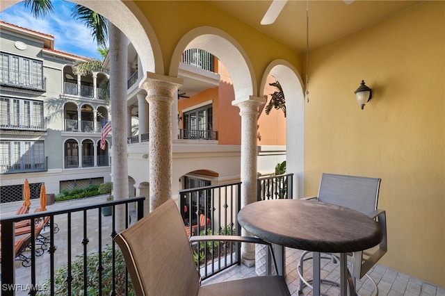 balcony with ceiling fan and outdoor dining area