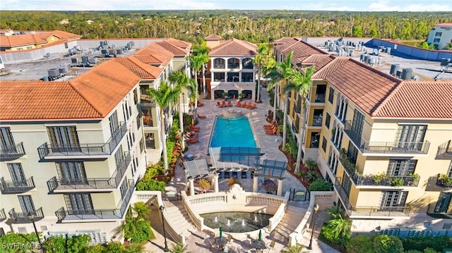 bird's eye view with a wooded view