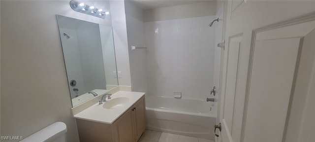 full bathroom featuring tiled shower / bath combo, vanity, tile patterned flooring, and toilet