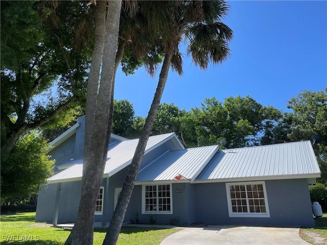 back of house with a yard