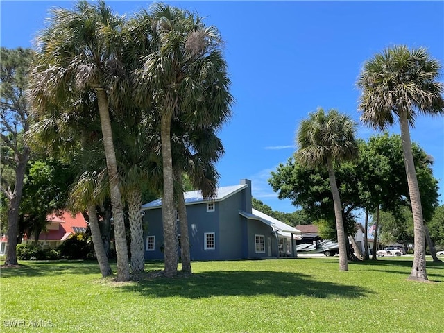 view of home's exterior with a lawn